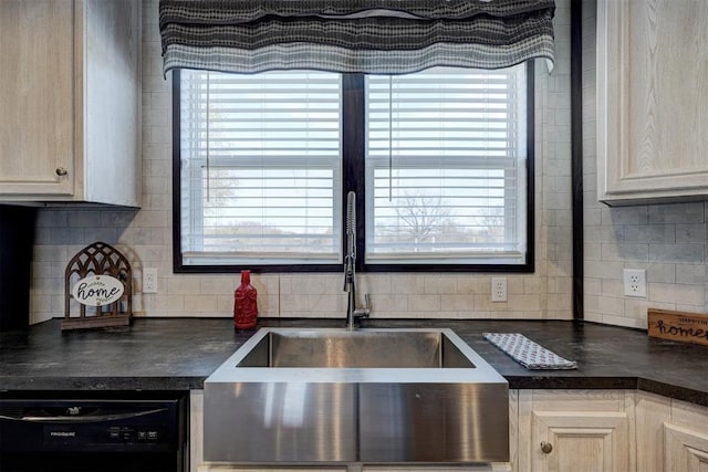 kitchen featuring dishwasher, decorative backsplash, sink, and light brown cabinetry