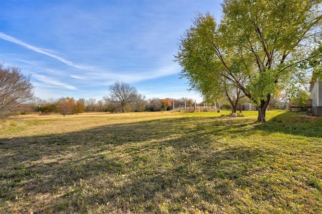 view of yard with a rural view