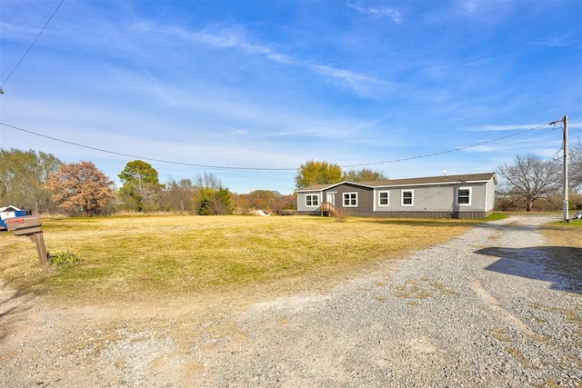 ranch-style home with a front lawn