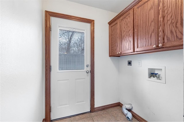 laundry room featuring electric dryer hookup, light tile patterned flooring, cabinets, and hookup for a washing machine