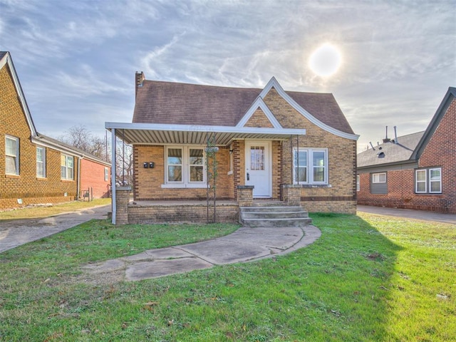 view of front of house with a front yard and a porch