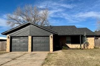 ranch-style house featuring a garage