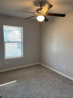 spare room featuring carpet flooring and ceiling fan