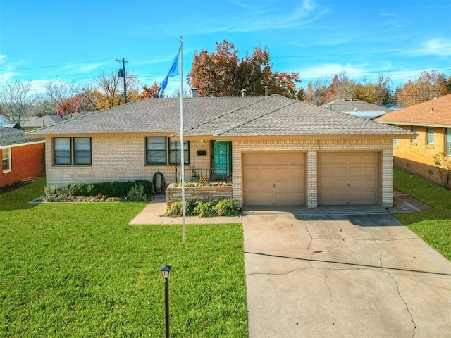 ranch-style house featuring a garage and a front yard