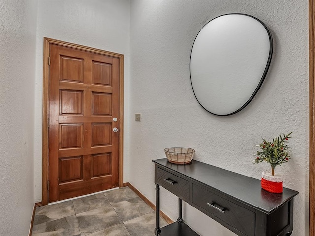 entryway with tile patterned floors