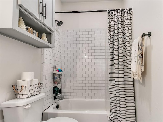 bathroom featuring shower / bath combo and toilet