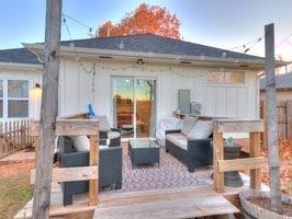 exterior space with outdoor lounge area and fence