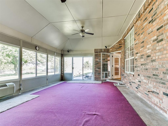 826 S Mustang Rd, Tuttle, OK 73089 - unfurnished sunroom featuring ceiling fan, a wall mounted AC, and vaulted ceiling