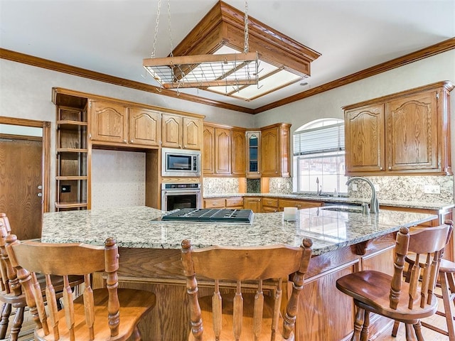 826 S Mustang Rd, Tuttle, OK 73089 - kitchen featuring stainless steel appliances, decorative backsplash, light stone countertops, a kitchen bar, and crown molding
