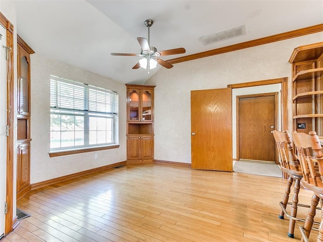826 S Mustang Rd, Tuttle, OK 73089 - spare room with lofted ceiling, a ceiling fan, and light wood-style floors