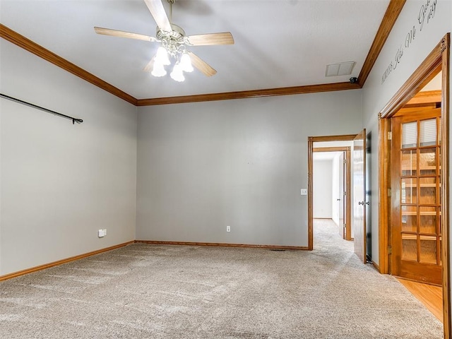 826 S Mustang Rd, Tuttle, OK 73089 - carpeted spare room featuring ornamental molding and a ceiling fan