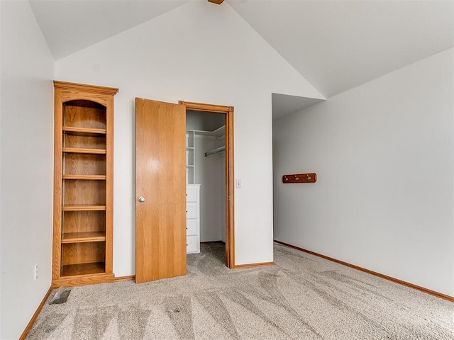 826 S Mustang Rd, Tuttle, OK 73089 - unfurnished bedroom with a spacious closet, lofted ceiling, carpet, and a closet