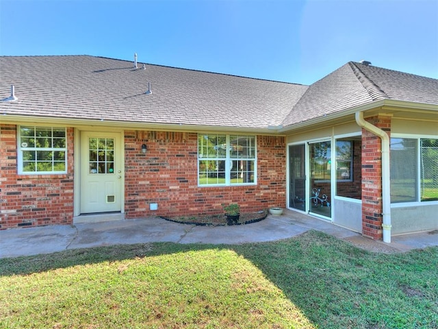 826 S Mustang Rd, Tuttle, OK 73089 - back of property with a yard, brick siding, and roof with shingles