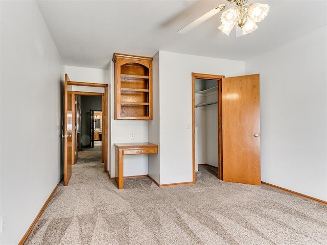 826 S Mustang Rd, Tuttle, OK 73089 - unfurnished bedroom with light carpet, a closet, and ceiling fan