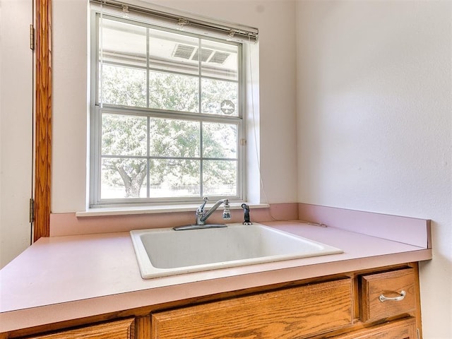 826 S Mustang Rd, Tuttle, OK 73089 - kitchen with light countertops and brown cabinets