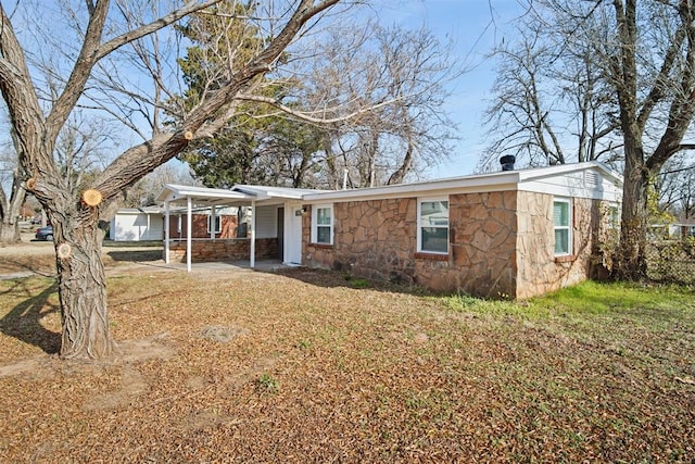 ranch-style house with a carport