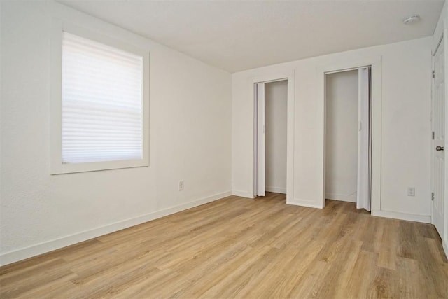 unfurnished bedroom featuring light hardwood / wood-style flooring