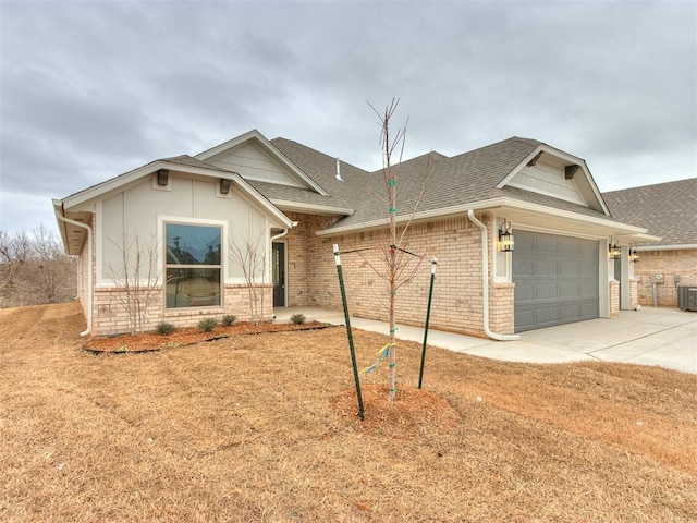 ranch-style home with a garage and cooling unit