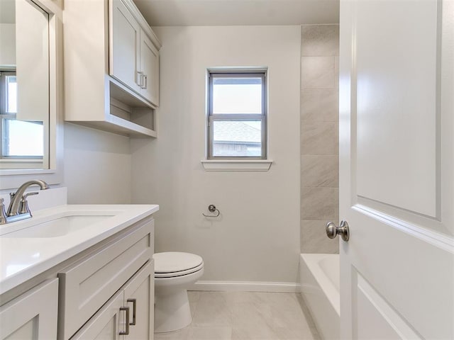 full bathroom featuring toilet, vanity, and baseboards