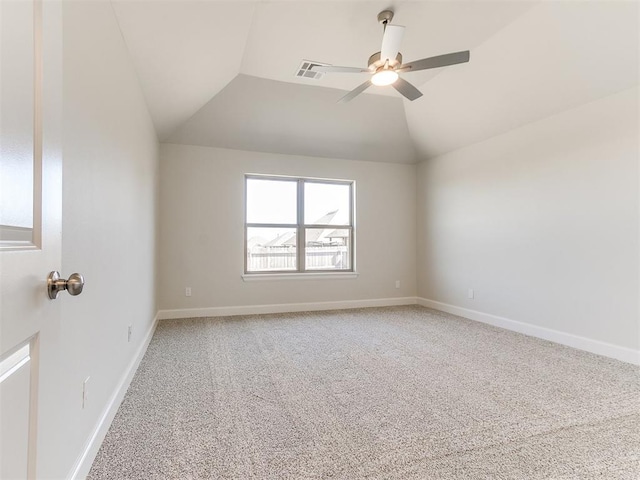 unfurnished room with lofted ceiling, baseboards, visible vents, and light carpet