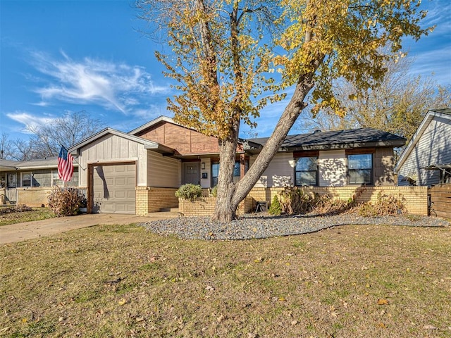 view of front of property with a garage and a front lawn