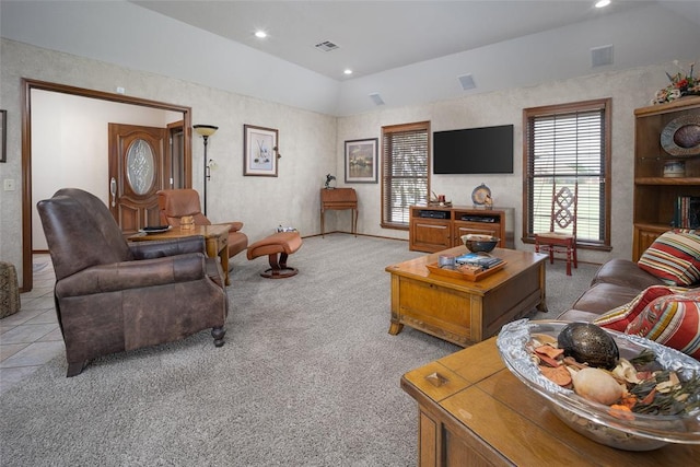 carpeted living room with vaulted ceiling