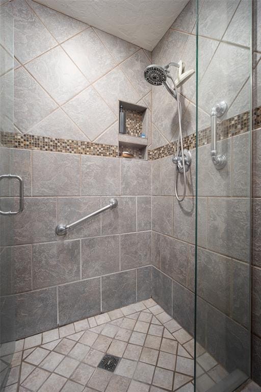 bathroom with a shower with shower door