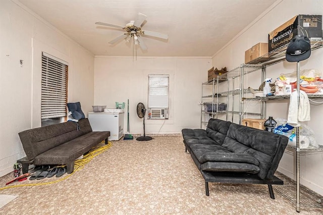 sitting room featuring carpet, cooling unit, ceiling fan, and crown molding