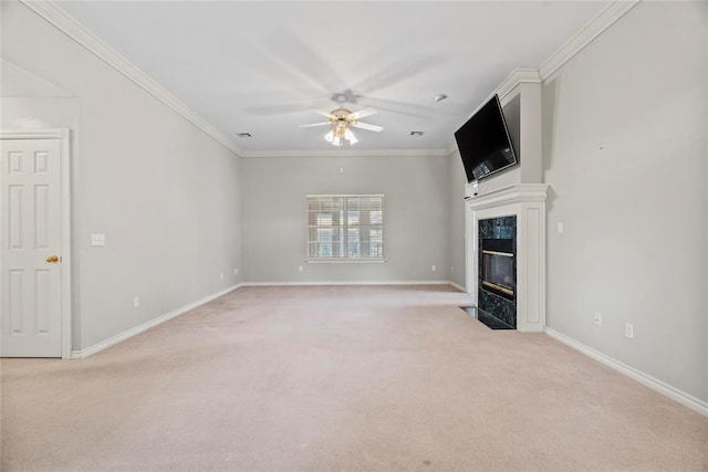 unfurnished living room with light carpet, ceiling fan, crown molding, and a premium fireplace