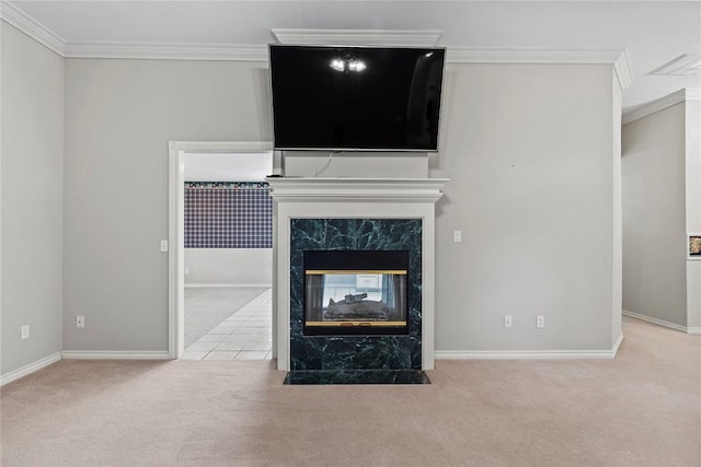 unfurnished living room with a fireplace, light colored carpet, and crown molding