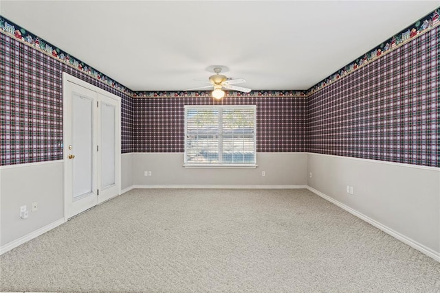 unfurnished room featuring carpet flooring and ceiling fan