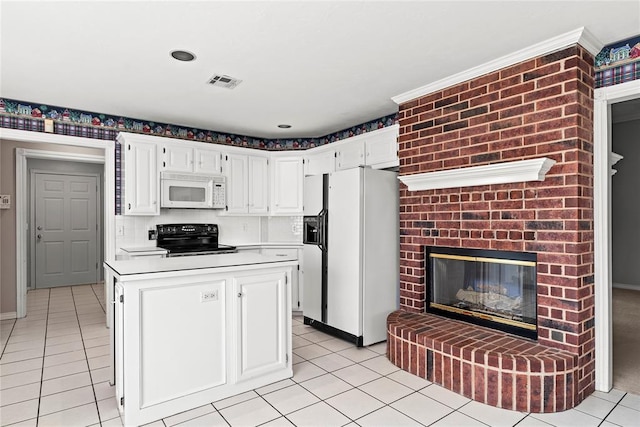 kitchen with a fireplace, a center island, white cabinets, and white appliances