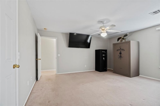 unfurnished bedroom with ceiling fan and light carpet