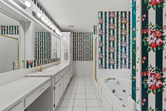 bathroom featuring vanity, a tub to relax in, and tile patterned floors