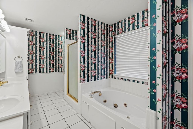 bathroom with tile patterned flooring, vanity, and plus walk in shower