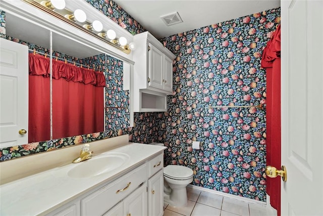 bathroom with tile patterned flooring, vanity, curtained shower, and toilet