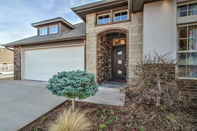 view of exterior entry with a garage