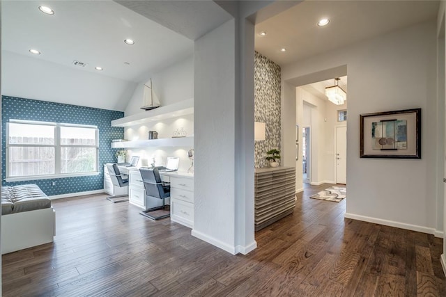 kitchen with dark hardwood / wood-style floors, white cabinetry, and lofted ceiling