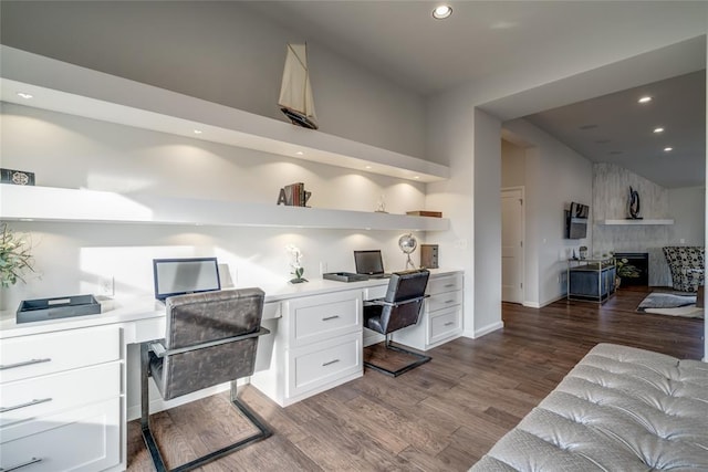 office space featuring hardwood / wood-style floors and built in desk