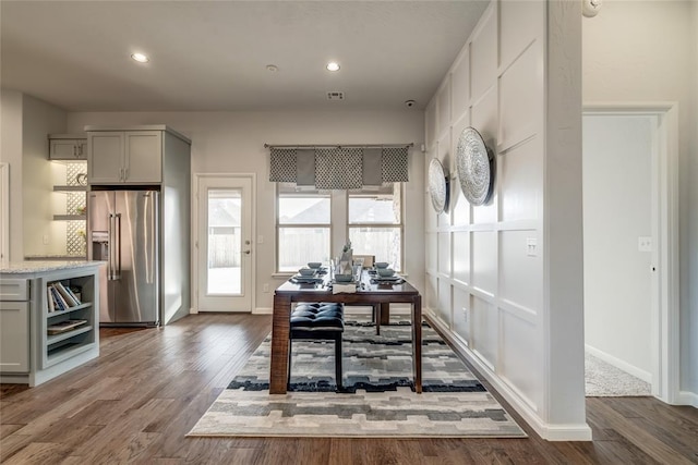 dining area with dark wood-type flooring