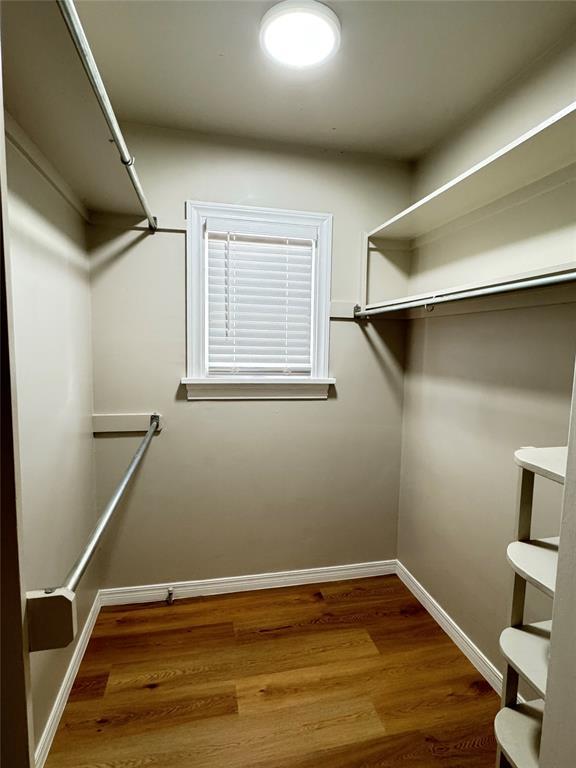 walk in closet featuring hardwood / wood-style floors