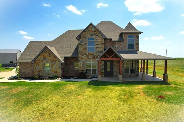 view of front of property featuring a patio and a front lawn