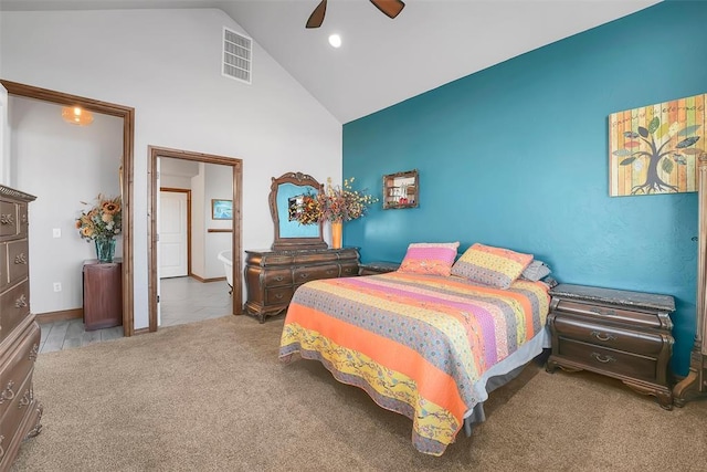 carpeted bedroom with vaulted ceiling and ceiling fan