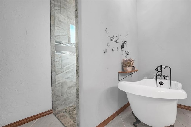 bathroom featuring tile patterned floors and a bathing tub