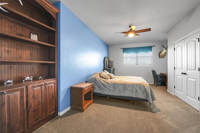 bedroom featuring carpet flooring, ceiling fan, and a closet