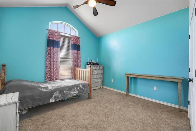 carpeted bedroom featuring ceiling fan and vaulted ceiling