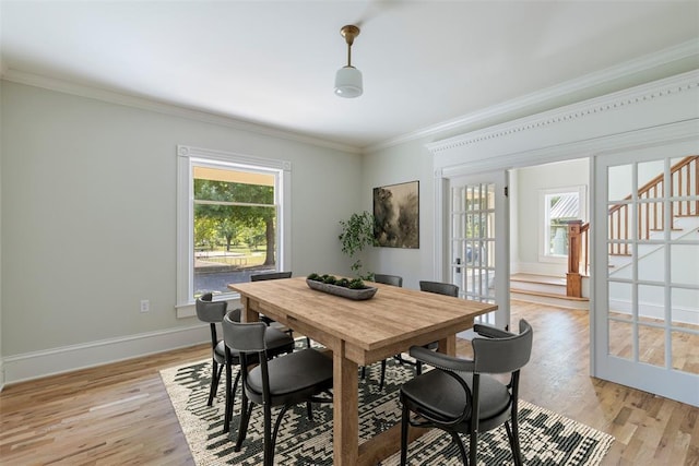 124 N Pesotum Ave, Shawnee, OK 74801 - dining room with crown molding, stairs, light wood-style flooring, and baseboards