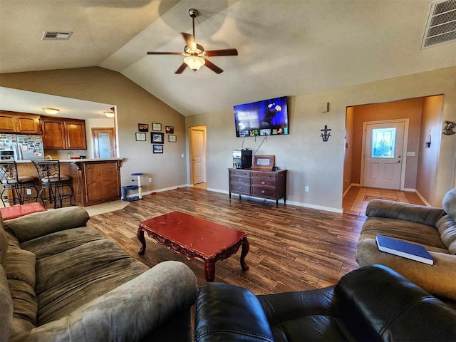 living area featuring ceiling fan, baseboards, light wood-style floors, and visible vents