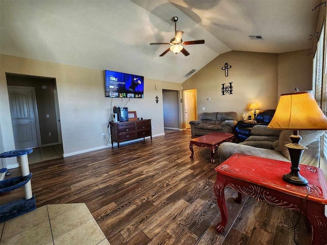 living room featuring wood finished floors, vaulted ceiling, visible vents, and a ceiling fan