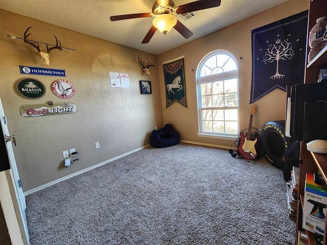 playroom featuring visible vents, carpet flooring, baseboards, and a ceiling fan